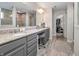 Elegant bathroom with double vanity, granite countertops, and a walk-in closet providing ample space and storage at 12650 Sunrise Dr, Noblesville, IN 46060