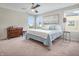 Serene bedroom with a comfortable bed, dresser, and two windows, creating a relaxing and inviting atmosphere at 12650 Sunrise Dr, Noblesville, IN 46060