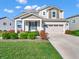 Charming two-story home featuring a well-manicured lawn and a two-car garage, complete with welcoming curb appeal at 12650 Sunrise Dr, Noblesville, IN 46060