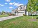 Charming two-story home with a well-maintained lawn, landscaping, and an attached two-car garage at 12650 Sunrise Dr, Noblesville, IN 46060