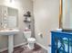 Stylish half bathroom featuring modern fixtures and a decorative vanity, perfect for guests at 12650 Sunrise Dr, Noblesville, IN 46060