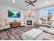 Inviting living room featuring a fireplace, comfortable seating, and abundant natural light for a cozy feel at 12650 Sunrise Dr, Noblesville, IN 46060