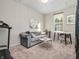 Comfortable living room with a cozy couch, natural light, and a serene ambiance for relaxation at 12650 Sunrise Dr, Noblesville, IN 46060