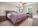 Inviting main bedroom with a large bed, wood furniture, plush carpets, and natural light at 12650 Sunrise Dr, Noblesville, IN 46060