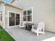 Relaxing patio area with sliding glass doors and outdoor seating near green grass at 12650 Sunrise Dr, Noblesville, IN 46060