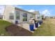 The backyard patio features a grill and tidy landscaping with a manicured lawn beyond at 12819 Bardolino Dr, Fishers, IN 46037