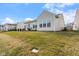 The well-maintained backyard with a patio and view of neighboring homes at 12819 Bardolino Dr, Fishers, IN 46037