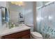A functional bathroom with a vanity, toilet, mirror, and shower with curtain at 12819 Bardolino Dr, Fishers, IN 46037