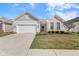 Charming single-Gathering home featuring a two-car garage, well-kept lawn, and manicured landscaping at 12819 Bardolino Dr, Fishers, IN 46037