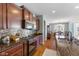 Stylish kitchen with dark cabinets, granite countertops, and backsplash tiling at 12819 Bardolino Dr, Fishers, IN 46037