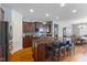 Well-appointed kitchen featuring dark wood cabinets and a granite countertop island at 12819 Bardolino Dr, Fishers, IN 46037