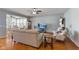 Cozy living room with hardwood floors, ceiling fan and comfortable seating arrangement at 12819 Bardolino Dr, Fishers, IN 46037