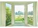 Bright bay window overlooking the beautifully landscaped front yard at 13060 Wembly Cir, Carmel, IN 46033