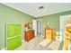Green bedroom with carpet and multiple wood dressers at 13060 Wembly Cir, Carmel, IN 46033
