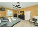 Primary bedroom featuring a fan, neutral carpet, and a window at 13060 Wembly Cir, Carmel, IN 46033