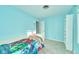 Bright blue bedroom with carpet, white trim, and white shelving at 13060 Wembly Cir, Carmel, IN 46033