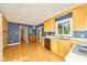 Spacious eat-in kitchen with plentiful cabinets and access to a rear patio at 13060 Wembly Cir, Carmel, IN 46033