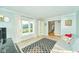 Inviting living room with lots of natural light, neutral carpet and stylish decor at 13060 Wembly Cir, Carmel, IN 46033