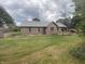 Spacious backyard with a well-manicured lawn and a small wooden deck at 145 Goodnight Rd, Martinsville, IN 46151