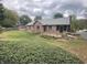 Scenic backyard featuring a wooden deck and lush greenery, creating a serene outdoor space at 145 Goodnight Rd, Martinsville, IN 46151