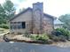 Backyard with mature trees and a brick chimney at 145 Goodnight Rd, Martinsville, IN 46151