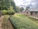 Lush backyard featuring a combination of manicured lawn and mature shrubbery at 145 Goodnight Rd, Martinsville, IN 46151