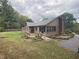 View of the home's exterior highlighting the yard and landscaping at 145 Goodnight Rd, Martinsville, IN 46151