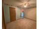 Bedroom featuring a ceiling fan, beige carpet, and light-blue walls with decorative trim at 145 Goodnight Rd, Martinsville, IN 46151