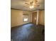 Bedroom features a ceiling fan, blue carpet, and light-yellow walls with decorative trim at 145 Goodnight Rd, Martinsville, IN 46151