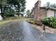 Brick home featuring a driveway and a brick chimney at 145 Goodnight Rd, Martinsville, IN 46151