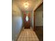 Entryway featuring neutral colored tile flooring and a decorative light fixture at 145 Goodnight Rd, Martinsville, IN 46151