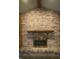Charming brick fireplace with a wooden mantle at 145 Goodnight Rd, Martinsville, IN 46151