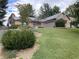 Charming single-story home with a brick facade, attached garage, and well-manicured lawn at 145 Goodnight Rd, Martinsville, IN 46151
