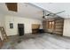 Spacious garage with built-in shelving units and garage door opener at 145 Goodnight Rd, Martinsville, IN 46151