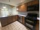 Modern kitchen with stainless steel appliances and wood cabinets at 145 Goodnight Rd, Martinsville, IN 46151