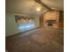 Cozy living room features a brick fireplace with built-in shelves and large window at 145 Goodnight Rd, Martinsville, IN 46151