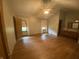 Main bedroom with hardwood floors, ceiling fan, and ensuite bathroom with double vanity at 145 Goodnight Rd, Martinsville, IN 46151