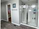 Modern bathroom featuring a glass shower with silver trim, towel rack, and luxury vinyl floors at 1566 Dorset Dr, Avon, IN 46123