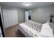 Carpeted bedroom featuring a double-door closet, neutral paint, and bright natural light at 1566 Dorset Dr, Avon, IN 46123