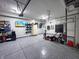 Well-organized garage with epoxy flooring, TV and ample storage, offering practical space at 1566 Dorset Dr, Avon, IN 46123