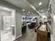 Hallway leading to a bathroom, rec room, and basement entertainment area at 1566 Dorset Dr, Avon, IN 46123