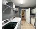 This laundry room features white cabinets, neutral walls, and tile floors at 1566 Dorset Dr, Avon, IN 46123