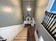 Carpeted staircase with a view of the entryway and the front door at 1566 Dorset Dr, Avon, IN 46123