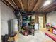 Unfinished basement with exposed rafters, storage, and mechanical components at 1566 Dorset Dr, Avon, IN 46123