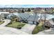 Aerial view of a home with a two-car garage, landscaped yard, and water views at 1852 Lakeside Ln, Indianapolis, IN 46229
