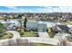 Overhead view of a home with a two-car garage, nice landscaping, and views of the water at 1852 Lakeside Ln, Indianapolis, IN 46229