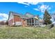 Angled view of the back of the house showing the brick exterior and screened in porch at 1852 Lakeside Ln, Indianapolis, IN 46229