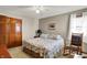 Comfortable bedroom with wood trim, rocking chair, and closet at 1852 Lakeside Ln, Indianapolis, IN 46229