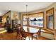 Charming dining room with views of the lake, hardwood floors and natural lighting at 1852 Lakeside Ln, Indianapolis, IN 46229