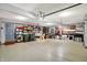 Spacious three car garage with epoxy floor, featuring ample storage shelving at 1852 Lakeside Ln, Indianapolis, IN 46229